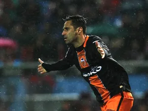 Valencia's Jonas celebrates a goal against Atletico Madrid on March 31, 2013