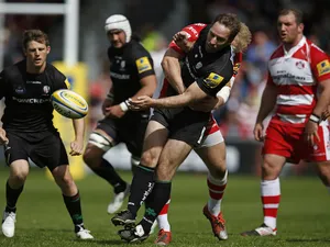 Tomas O'Leary of London Irish is hit by a late tackle by Matt Kvesic of Gloucester during the Aviva Premiership match between Gloucester Rugby and London Irish at Kingsholm Stadium on May 9, 2015
