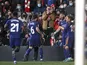 Real Madrid's Karim Benzema celebrates scoring their first goal with teammates on February 26, 2022