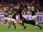 South Africa's Cheslin Kolbe in action with New Zealand's Beauden Barrett on September 21, 2019