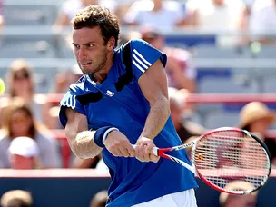 Gulbis edges out Dimitrov
