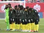 The Jamaica national team stand for the anthems before playing Canada in a FIFA World Cup qualifying soccer match at BMO Field on March 27, 2022
