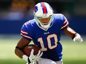T.J. Graham #10 of the Buffalo Bills runs the ball against the Indianapolis Colts at Lucas Oil Stadium on August 11, 2013