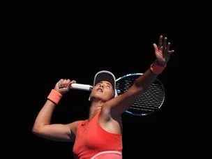 Muguruza fights through first round