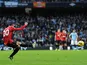 Robin Van Persie strikes the ball to score the winner against rivals Manchester City on December 9, 2012