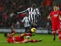 Adam Lallana slides in on Demba Ba on November 25, 2012