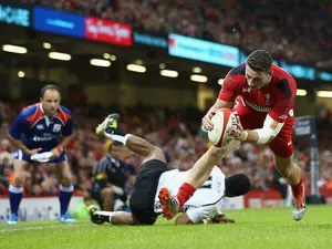 Alex Cuthbert (R) of beats Asaeli Tikoirotuma of Fiji to score his sides second try during the International match against Fiji on November 15, 2014