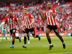 Brentford 2-0 Swansea: Bees promoted to Premier League for first time