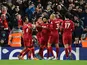 Liverpool's Mohamed Salah celebrates scoring their first goal with teammates on February 23, 2022