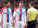 Crystal Palace's Maxence Lacroix and Jorgen Strand Larsen remonstrate with the referee on March 1, 2026
