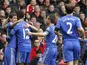 Goalscorer Oscar celebrates with his Chelsea teammates after giving his side the lead in the match against Liverpool on April 21, 2013