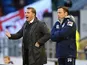 Opposing managers Brendan Rodgers and Paul Dickov stand on the touchline during the game between Oldham and Liverpool on January 27, 2013