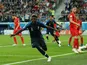 France defender Samuel Umtiti wheels away in celebration after scoring the opening goal of his side's World Cup semi-final with Belgium on July 10, 2018