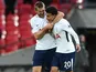 Eric Dier embraces Deli Alli during the Premier League game between Tottenham Hotspur and Liverpool on October 22, 2017