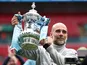 Manchester City manager Pep Guardiola celebrates with the FA Cup on May 16, 2026