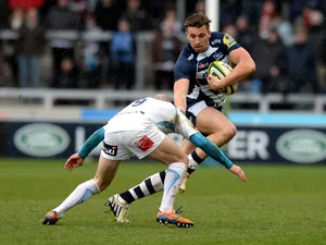 Charlie Ingall of Sale Sharks is tackled by Paul Hodgson of Worcester Warriors during the LV= Cup match between Sale Sharks and Worcester Warriors at AJ Bell Stadium on January 25, 2014