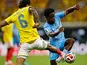 Richard Rios of Colombia battles for possession of the ball with Nathanael Mbuku of DR Congo