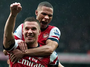 Late goals send Arsenal third