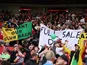 Manchester United fans display banners in protest against the Glazer family's ownership of the club on August 26, 2023