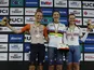 Italy's Martina Fidanza celebrates on the podium after winning the Women's Scratch Race alongside second place Netherlands' Maike van der Duin and third place Britain's Jessica Roberts on October 12, 2022