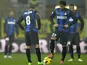Inter forward's Diego Milito and Rodrigo Palacio kick-off following a Parma goal on November 26, 2012