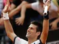 Novak Djokovic celebrates after defeating Alexandr Dolgopolov in the Rome Masters on May 16, 2013