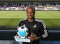 Andrew Ayew of Swansea City holds his Player of the Month award for August 2015