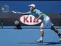 Kei Nishikori of Japan stretches for a shot during his second round match at the Australian Open tennis championship on January 16, 2013