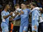 Manchester City's Bernardo Silva celebrates scoring their fourth goal with teammates on April 26, 2022