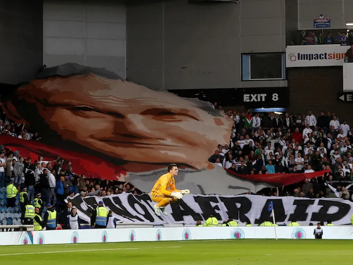 Legia Warsaw fans unfurl Pope John Paul II banner at Ibrox