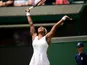 USA's Serena Williams celebrates in her second round match against France's Caroline Garcia at Wimbledon on June 27, 2013