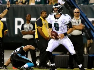 Nick Foles #9 of the Philadelphia Eagles carries the ball in for a touchdown against the Carolina Panthers on August 15, 2013
