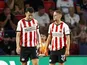 Ivan Perisic (L) and Joey Veerman of PSV Eindhoven look dejected on August 30, 2025