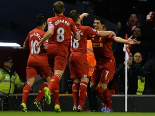 Suarez treble puts Liverpool three up