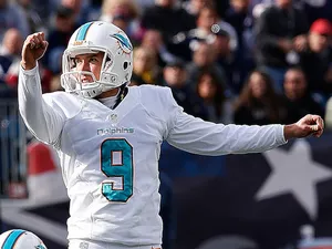 Caleb Sturgis of the Miami Dolphins watches his field goal in the 2nd quarter against the New England Patriots in the first half at Gillette Stadium on October 27, 2013