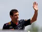 Red Bull driver Mark Webber waves to the crowd on May 12, 2013