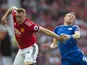 Phil Jones and Jamie Vardy in action during the Premier League game between Manchester United and Leicester City on August 26, 2017