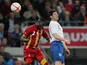 Ghana's Daniel Opare jumps for the ball alongside England's Matthew Jarvis during a friendly match on March 29, 2013
