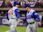 Chicago Cubs first baseman Anthony Rizzo (44) high fives third base coach Brian Butterfield (55) after hitting a home run in the fifth inning against the Pittsburgh Pirates at BB&T Ballpark at Historic Bowman Field.