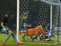 Sheffield Wednesday's English defender Sam Hutchinson (R) beats Arsenal's Czech goalkeeper Petr Cech (C) to score the team's third goal during the English League Cup fourth round football match between Sheffield Wednesday and Arsenal at The Hillsborough S