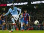 Manchester City's Ivorian midfielder and captain Yaya Toure scores their fourth goal from the penalty spot during the English League Cup fourth round football match between Manchester City and Crystal Palace at The Etihad Stadium in Manchester, north west