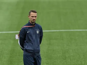 England's head coach Mark Sampson walks on the field at the Moncton Stadium on June 8, 2015