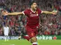 Emre Can celebrates scoring during the Champions League playoff between Liverpool and Hoffenheim on August 23, 2017