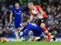 Eden Hazard goes down under Oriol Romeu during the Premier League game between Chelsea and Southampton on December 16, 2017
