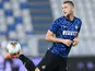 Milan Skriniar warms up for Inter on July 16, 2020