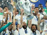 Real Madrid's Karim Benzema lifts the Champions League trophy on May 28, 2022