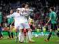 Cristiano Ronaldo of Real Madrid celebrates with teammate Gareth Bale after scoring the opening goal during the UEFA Champions League Round of 16 second leg match against Schalke on March 18, 2014
