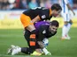 Sheffield Wednesday goalkeeper Keiren Westwood and teammate Sam Hutchinson forget themselves during the Championship match against Huddersfield Town on October 16, 2016