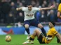 Tottenham Hotspur's Harry Winks in action with Wolverhampton Wanderers' Raul Jimenez on February 13, 2022