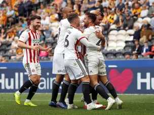 Sheffield United ease past Hull to close in on promotion